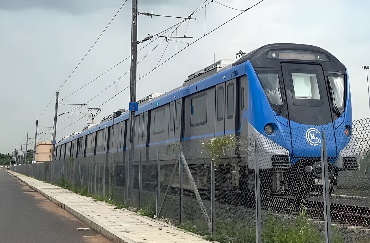 A blue Chennai Metro Phase 2 trainset on the tracks